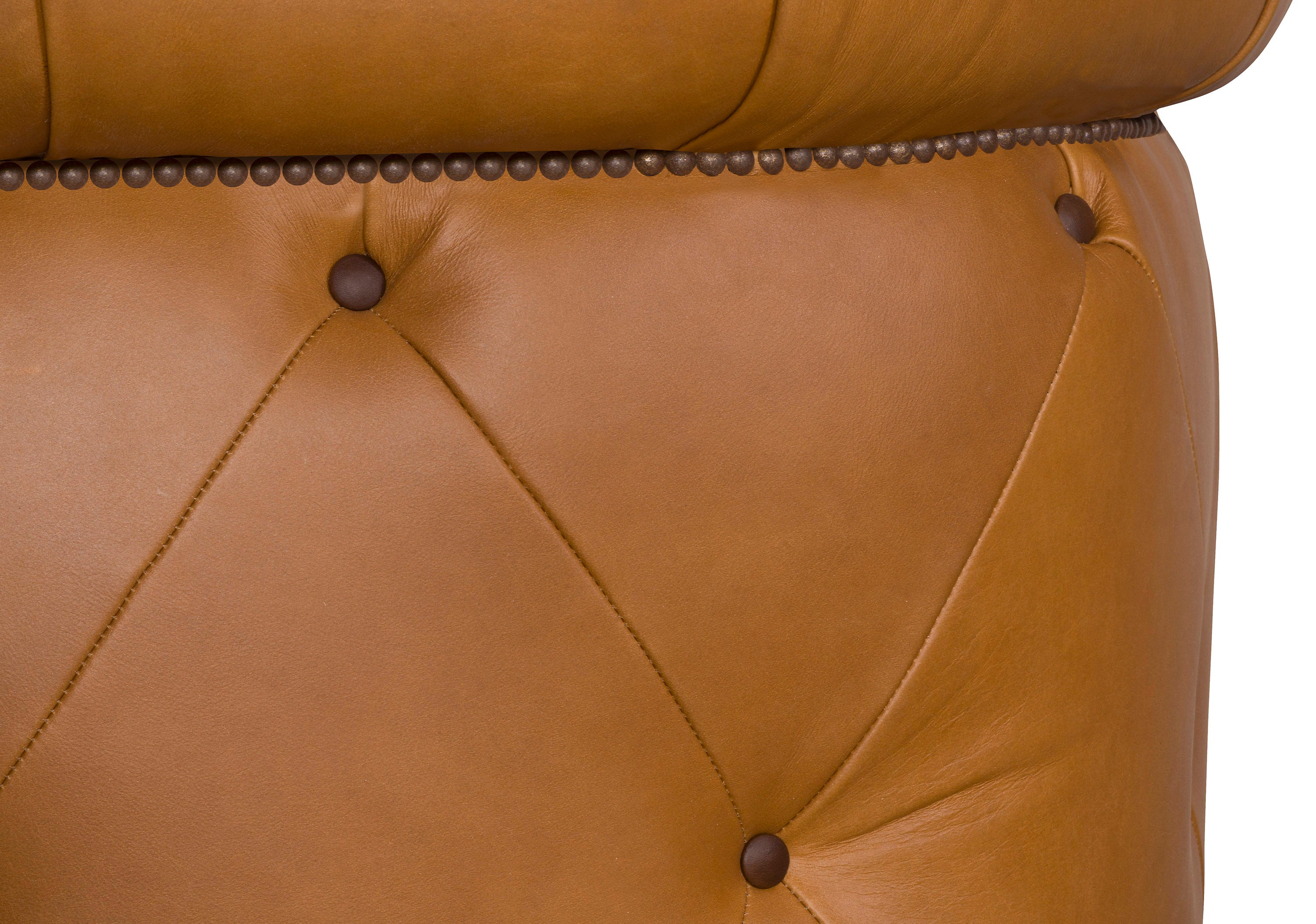 Close-up of a brown leather chair with diamond pattern and button details - Blue Mountain Brands USA