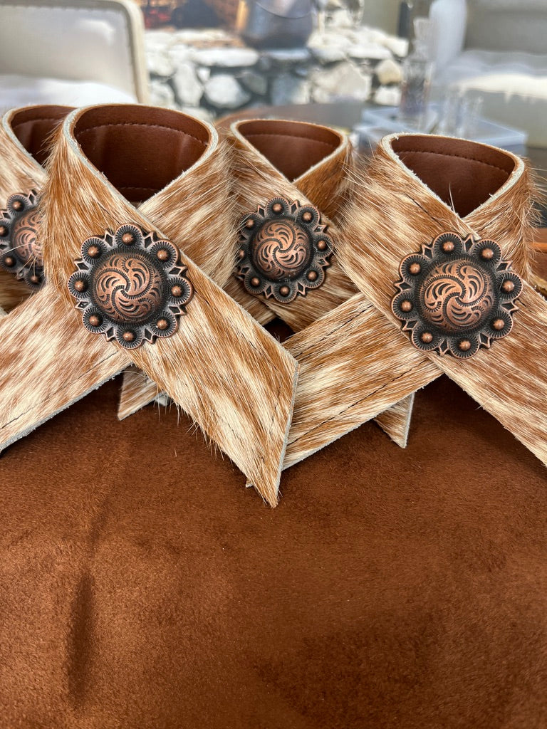Hand made brown and white peppered cowhide napkin rings with berry conchos - Your Western Decor
