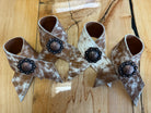 Hand made brown and white peppered cowhide napkin rings with berry conchos - Your Western Decor