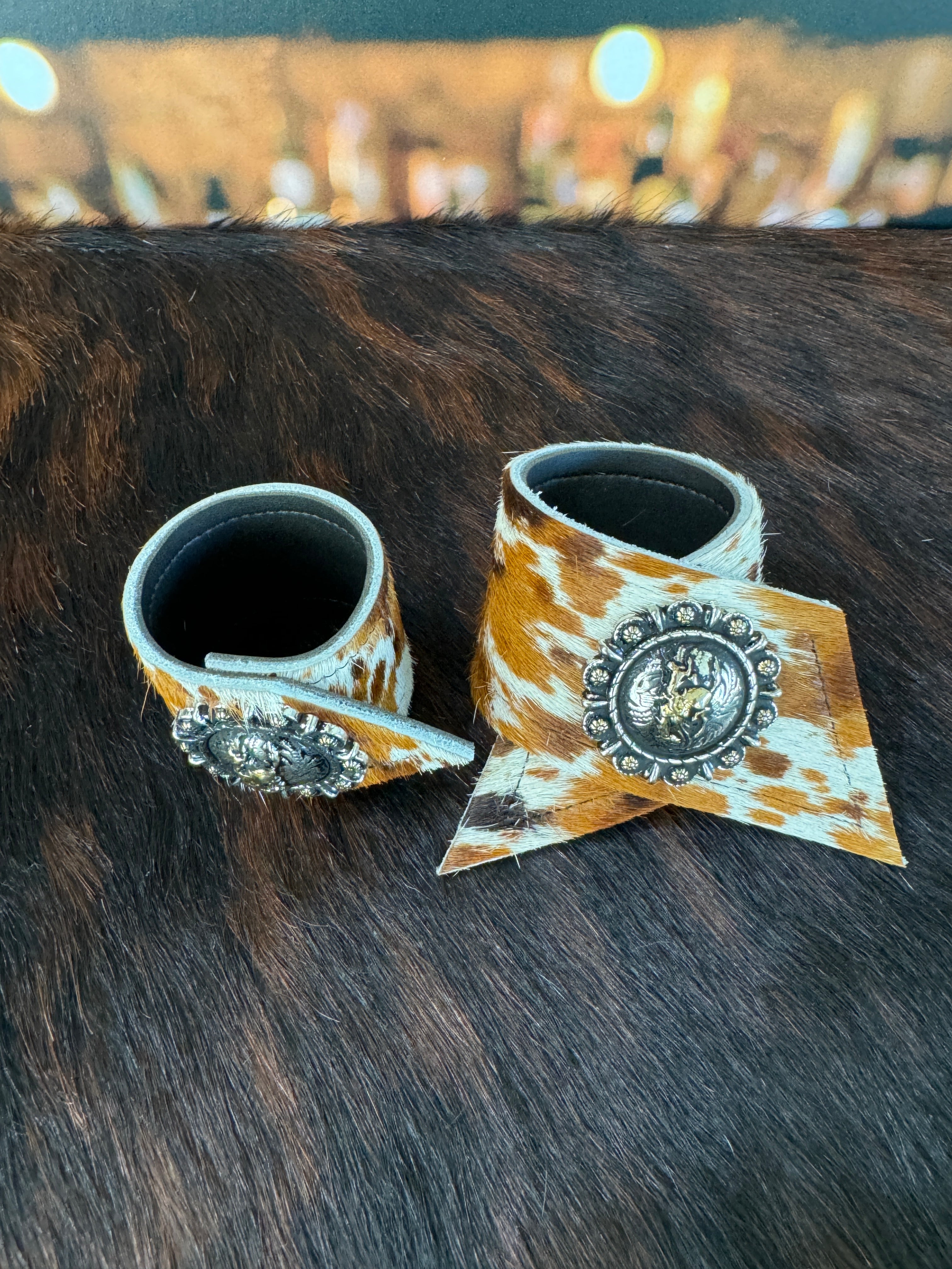 Custom Dyed Cowhide Napkin Rings with metal Pendleton Let 'er Buck conchos - Handmade in Oregon by Blue Mountain Brands USA
