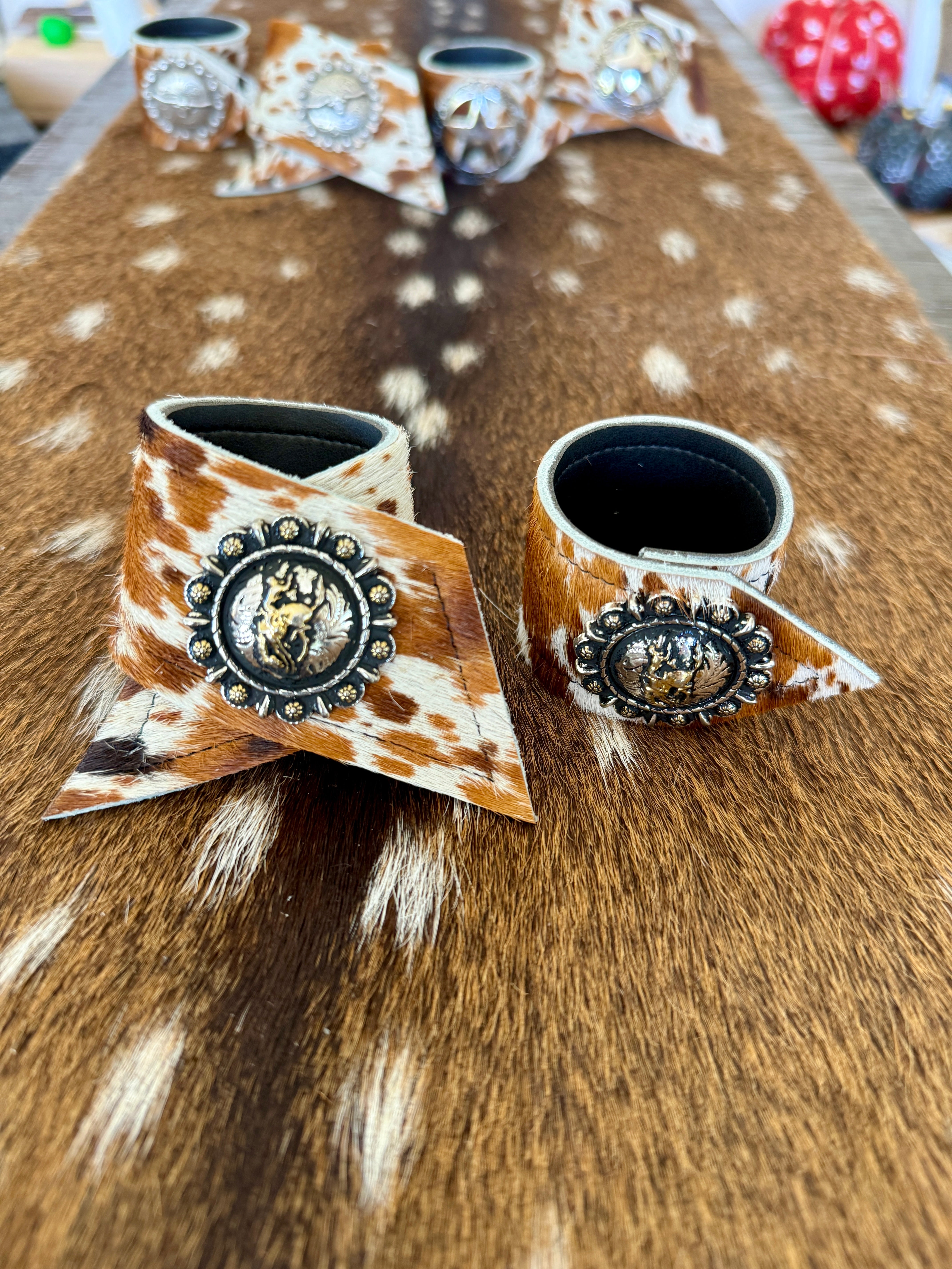 Custom Dyed Cowhide Napkin Rings with metal Pendleton Let 'er Buck conchos - Handmade in Oregon by Blue Mountain Brands USA
