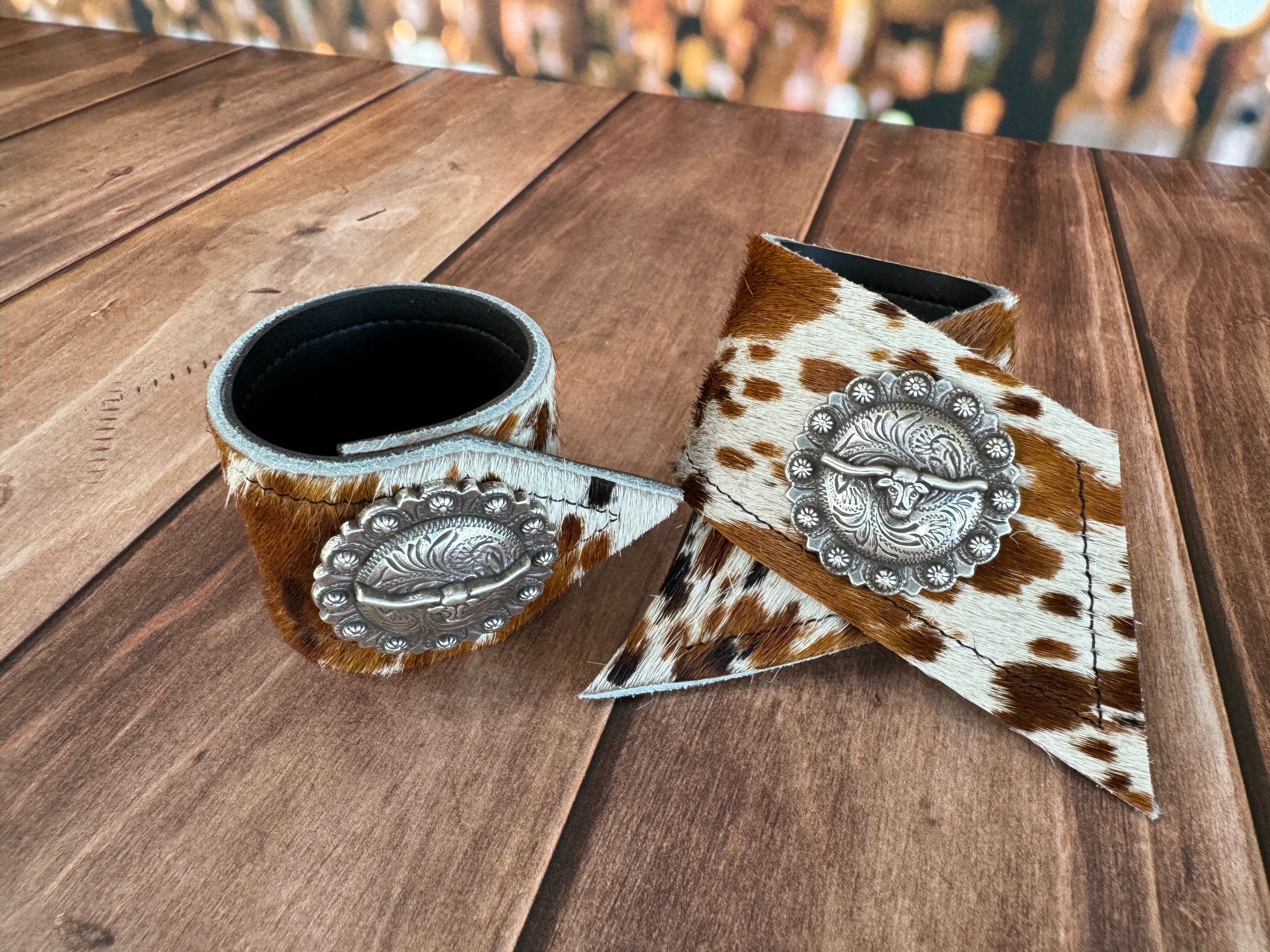 Custom Dyed Cowhide Napkin Rings with metal Longhorn Berry conchos - Handmade in Oregon by Blue Mountain Brands USA