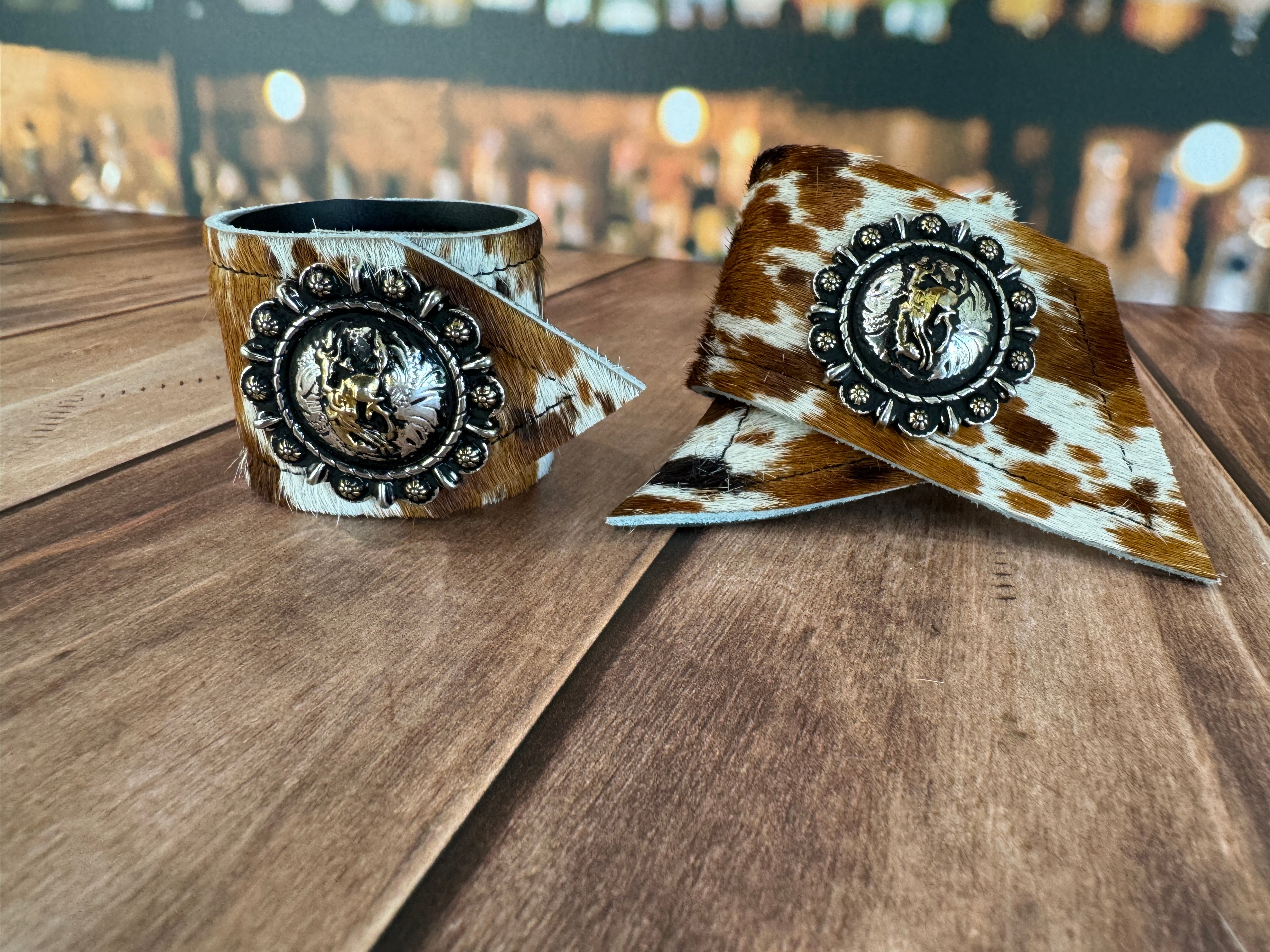 Custom Dyed Cowhide Napkin Rings with metal Let 'er Buck Berry conchos - Handmade in Oregon by Blue Mountain Brands USA