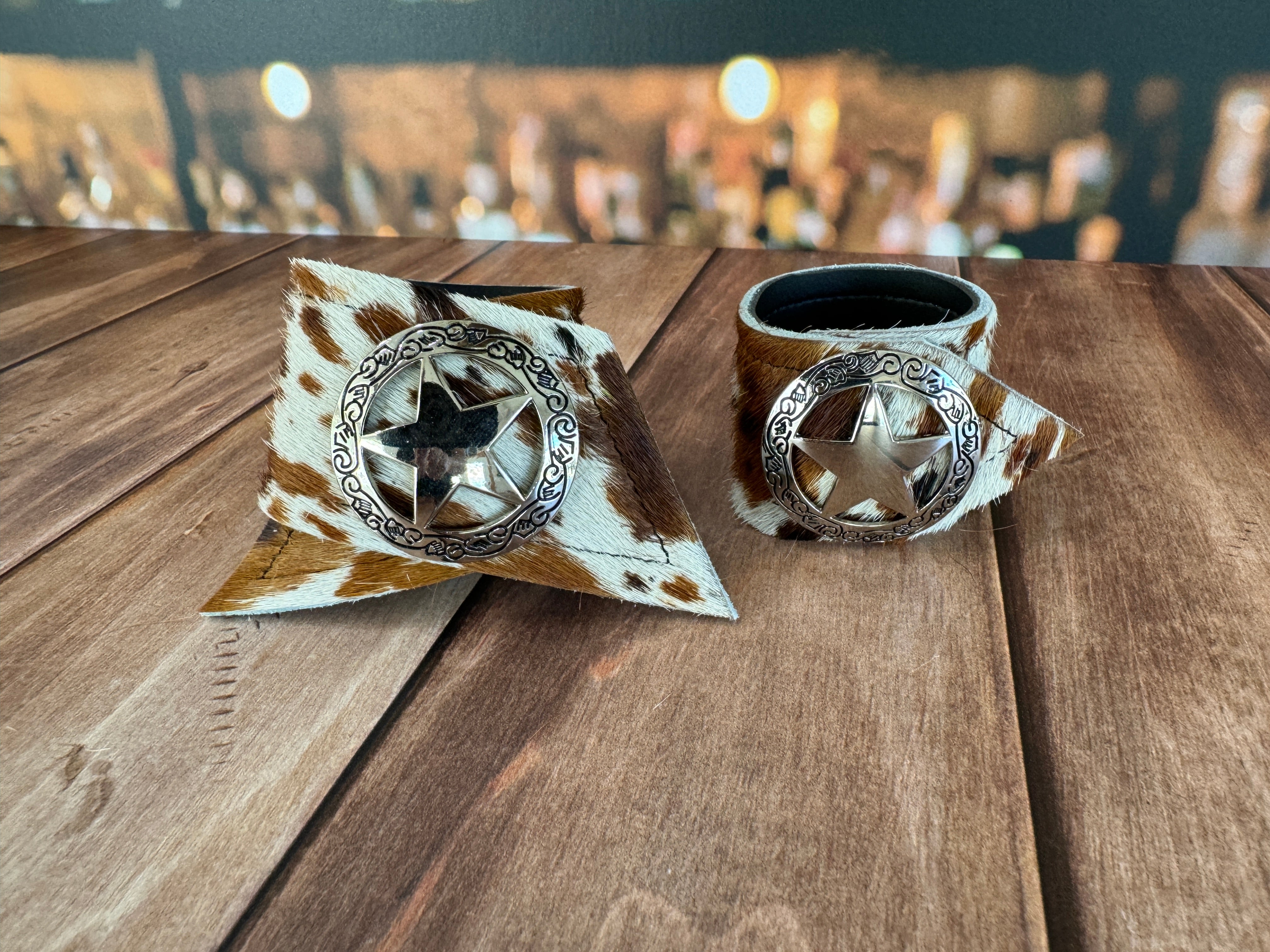 Custom Dyed Cowhide Napkin Rings with metal silver Sheriffs Badge conchos - Handmade in Oregon by Blue Mountain Brands USA