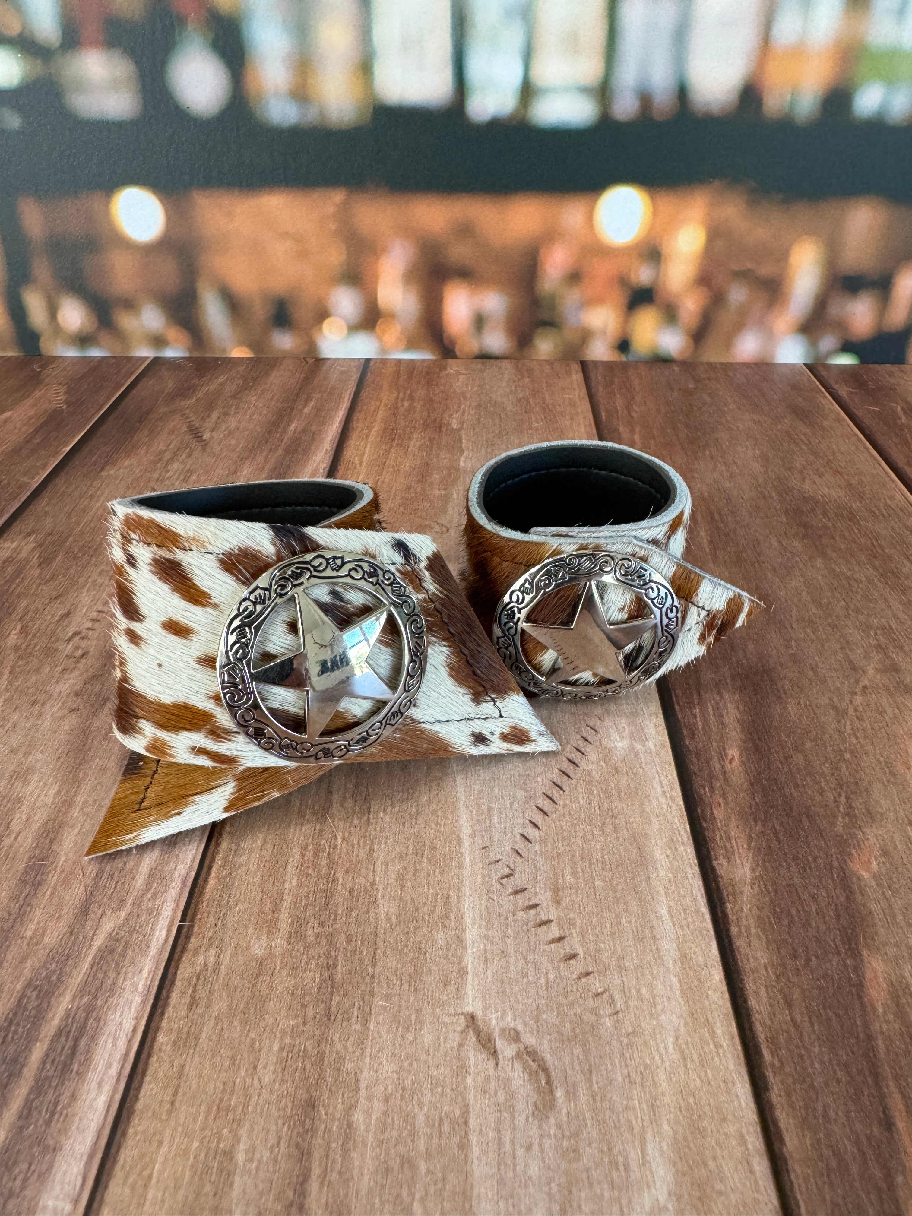 Custom Dyed Cowhide Napkin Rings with metal silver Sheriffs Badge conchos - Handmade in Oregon by Blue Mountain Brands USA