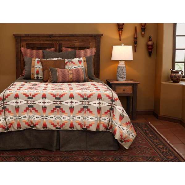 Bedroom with a wooden bed and Tucson Hawk bedding, nightstand with lamp, and decorative items on the wall -Blue Mountain Brands USA