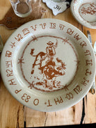 Blue Mountain Brands USA western dinner plate with bull rider, barbed wire and brands - Made in Pendleton, Oregon USA