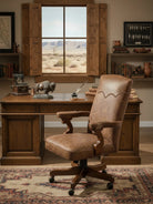 Wooden desk with leather office chair in a room with large window and bookshelves Blue Mountain Brands USA