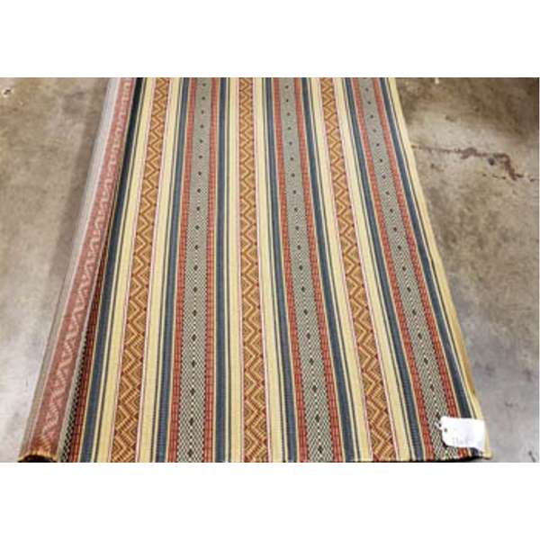 Striped fabric roll with geometric patterns on a concrete floor - Blue Mountain Brands USA