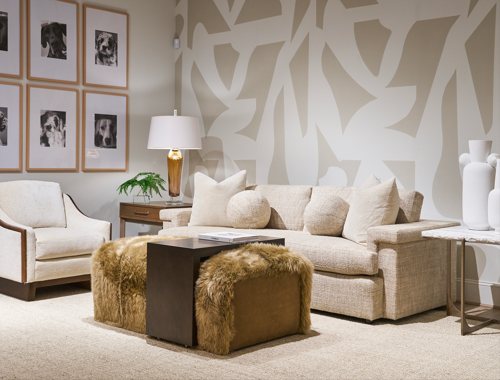 Living room with beige sofa, armchair, Over Under Cocktail Table and Ottoman, and decorative elements with dog pictures on the wall - American made furniture and decor at Blue Mountain Brands USA