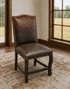 Tooled leather and smooth leather upholstered western dining chair with nail trim