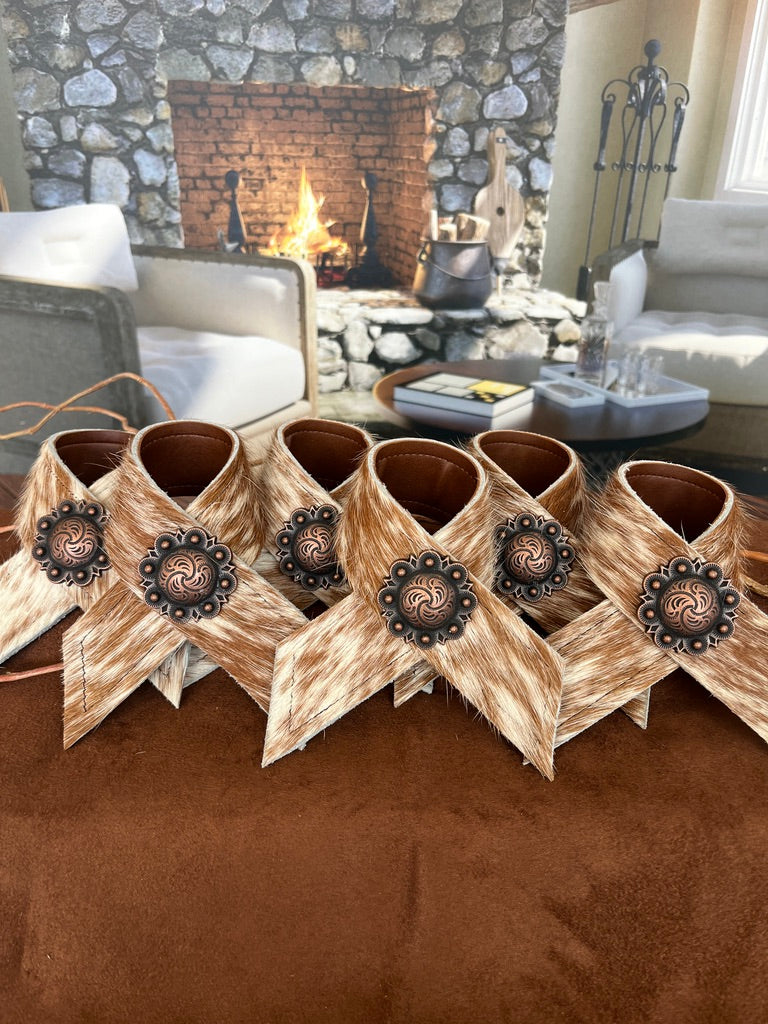 Hand made brown and white peppered cowhide napkin rings with berry conchos - Your Western Decor