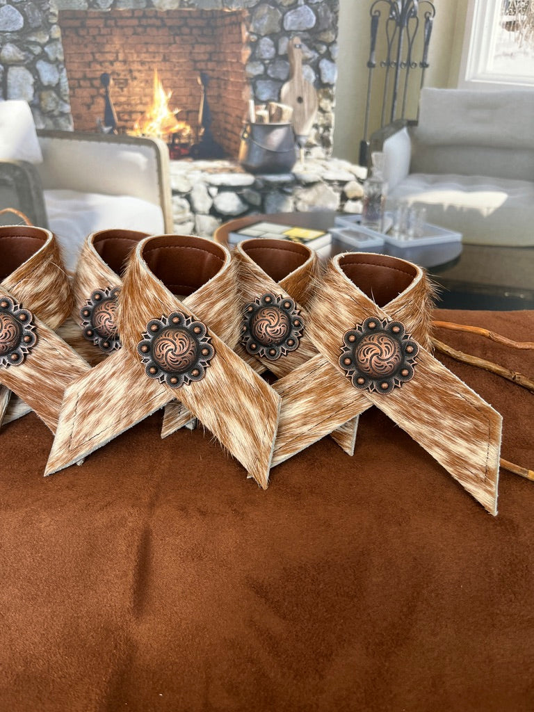 Hand made brown and white peppered cowhide napkin rings with berry conchos - Your Western Decor