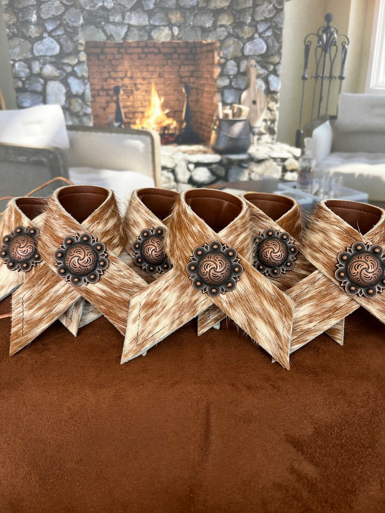 Hand made brown and white peppered cowhide napkin rings with berry conchos - Your Western Decor