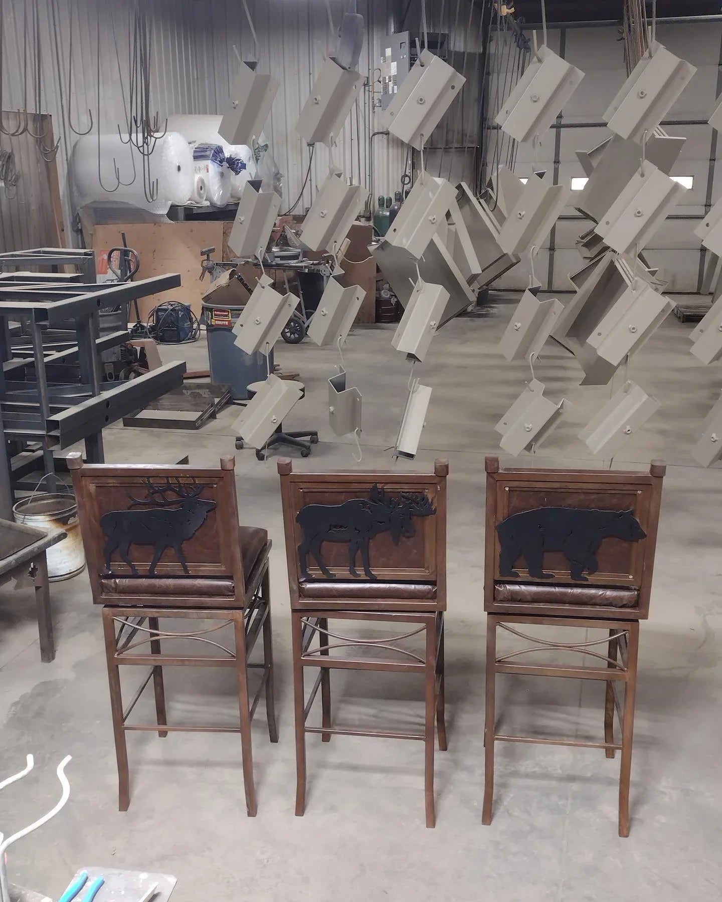 Custom option of iron wildlife images on backs of bar chairs - Your Western Decor