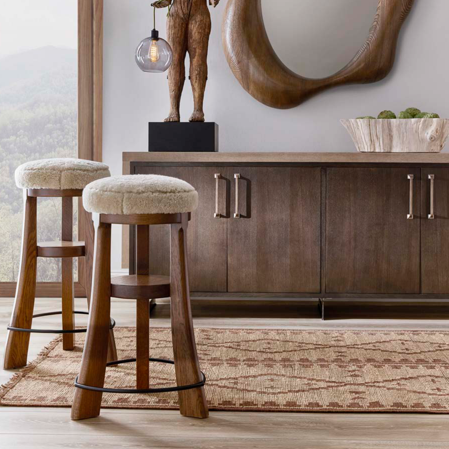 Wooden bar stools with cushioned seats in a room with a wooden cabinet and decorative items - Blue Mountain Brands USA