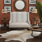 Living room with a beige armchair, wooden coffee table, and decorative elements - Blue Mountain Brands USA