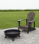 Wooden Adirondack chair next to a fire pit on a gravel area with grass in the background - Your Western Decor