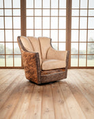 Chair with brown leather and beige cushion in a room with large windows - Blue Mountain Brands USA