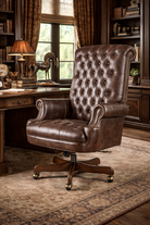 Brown tufted leather office chair in a classic office setting with bookshelves and a window.