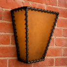 Western rawhide wall sconce with leather lacing