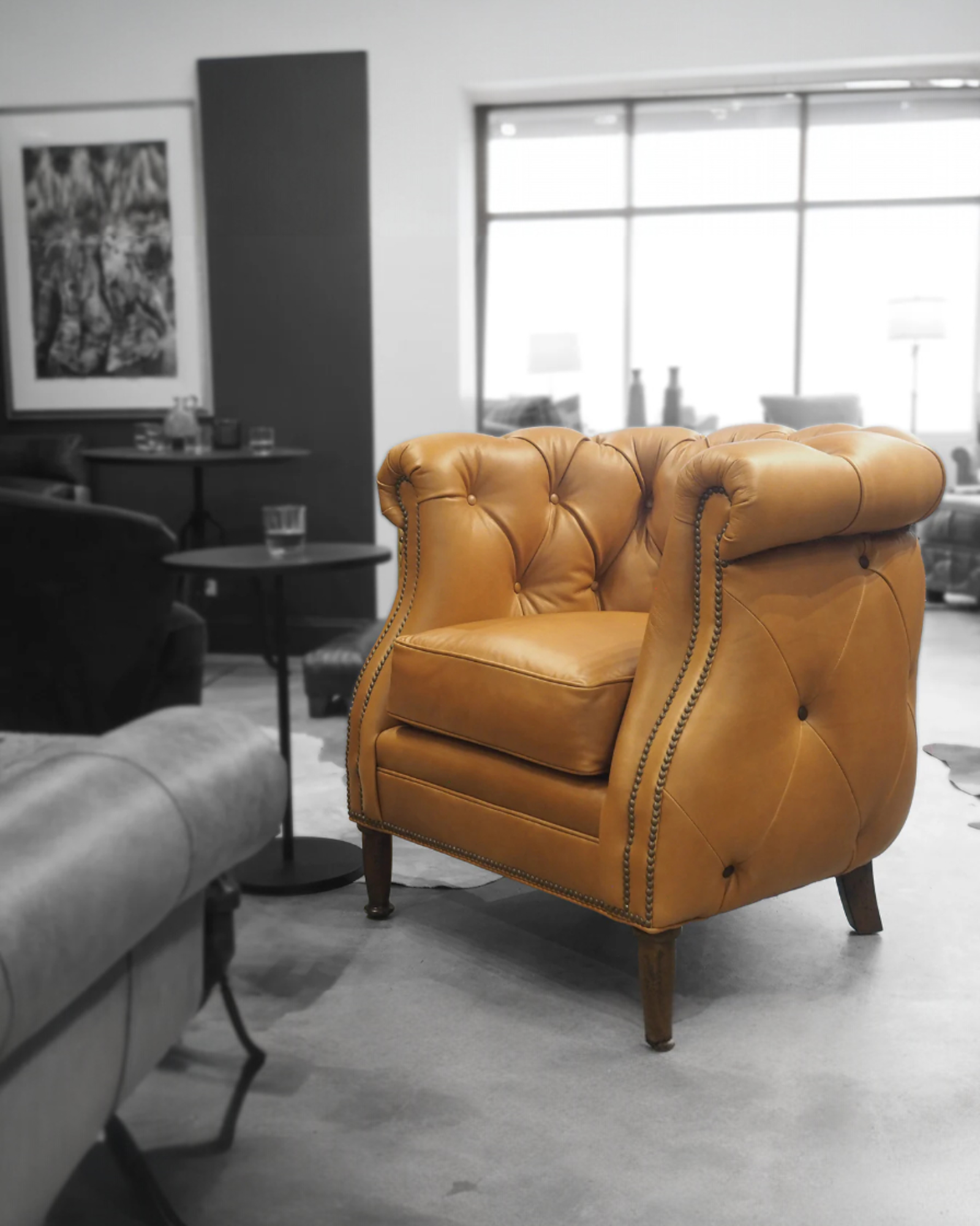 Brown leather armchair in a modern living room setting - Blue Mountain Brands USA