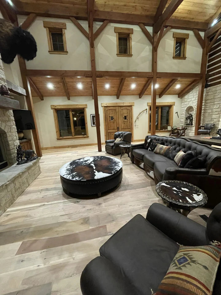 Western decorated living area with leather and cowhide furniture made in the USA - Blue Mountain Brands Home Furnishings USA