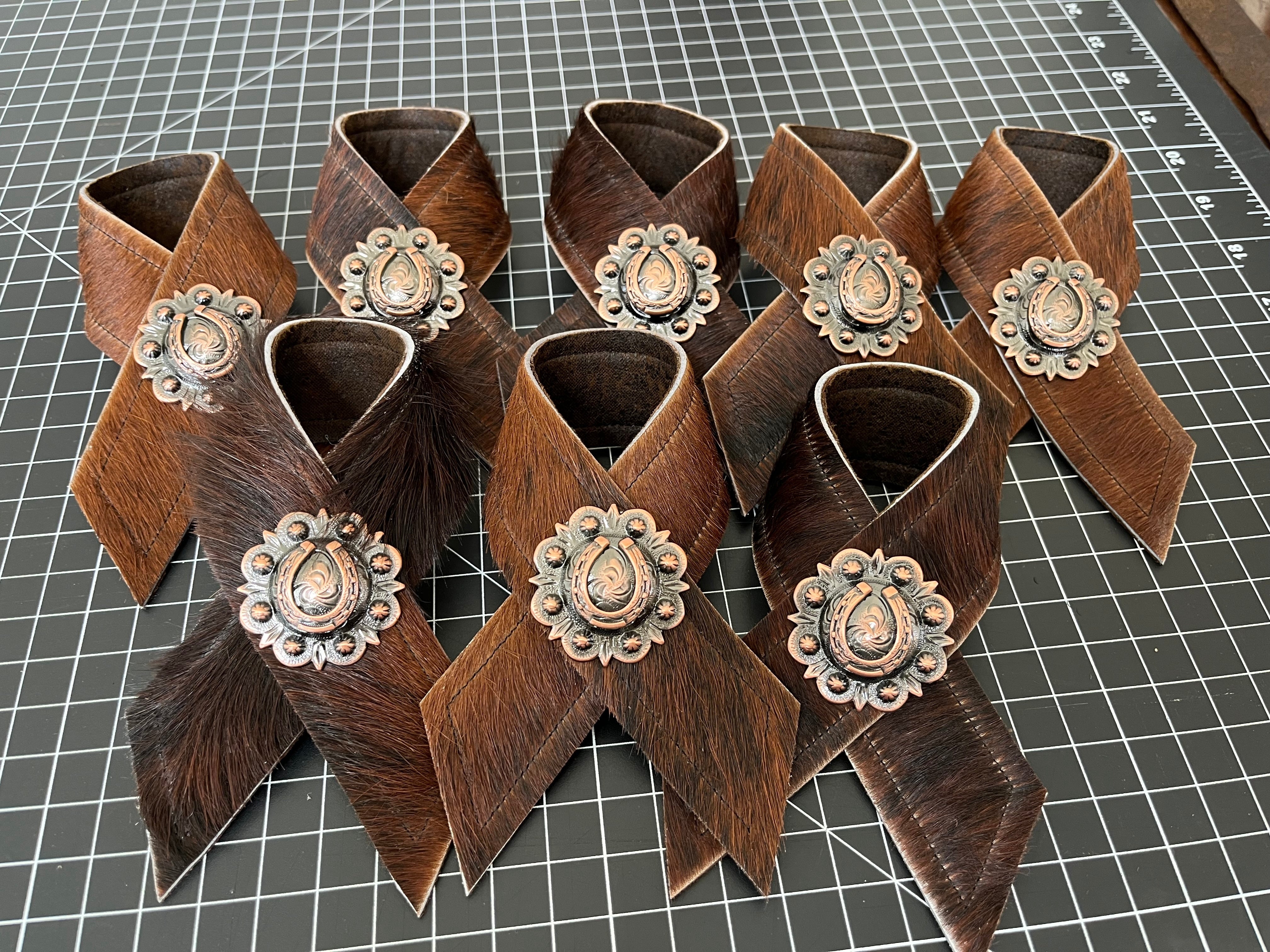 Brindle cowhide and horseshoe concho napkin rings handmade in the USA by Blue Mountain Brands USA Home Decor