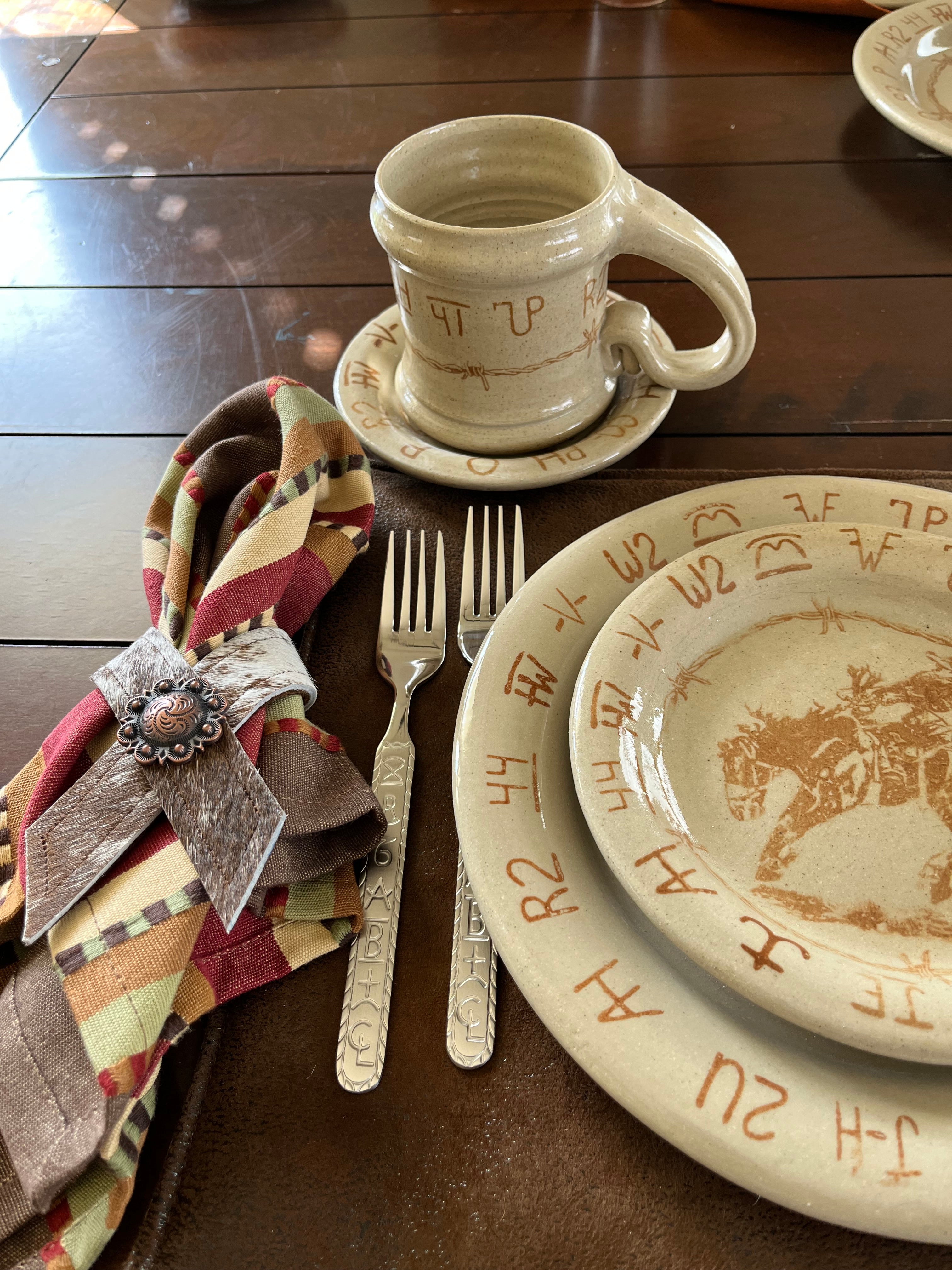 bronc and brands bread plate, salad plate, cup, saucer, napkin ring and flatware